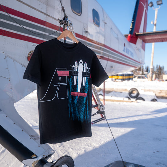 Air Tindi Twin Otter Floatplane T-Shirt hanging off a Twin Otter