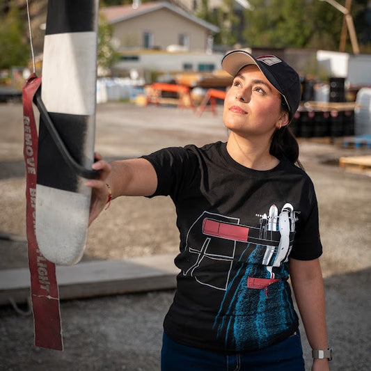 Model wearing the Air Tindi Twin Otter Wake Unisex T-Shirt