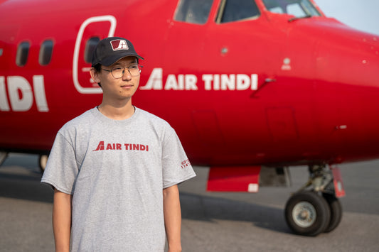 Model wearing an Air Tindi Active Unisex T-Shirt outdoors