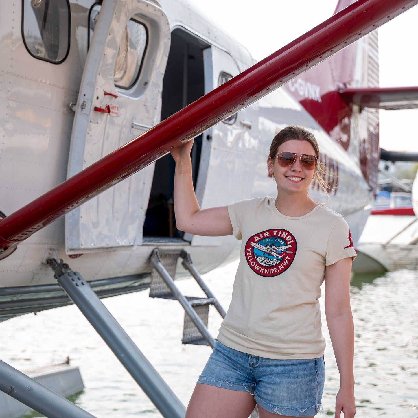 Model wearing an Air Tindi Classic Dash 7 T-Shirt in ladies