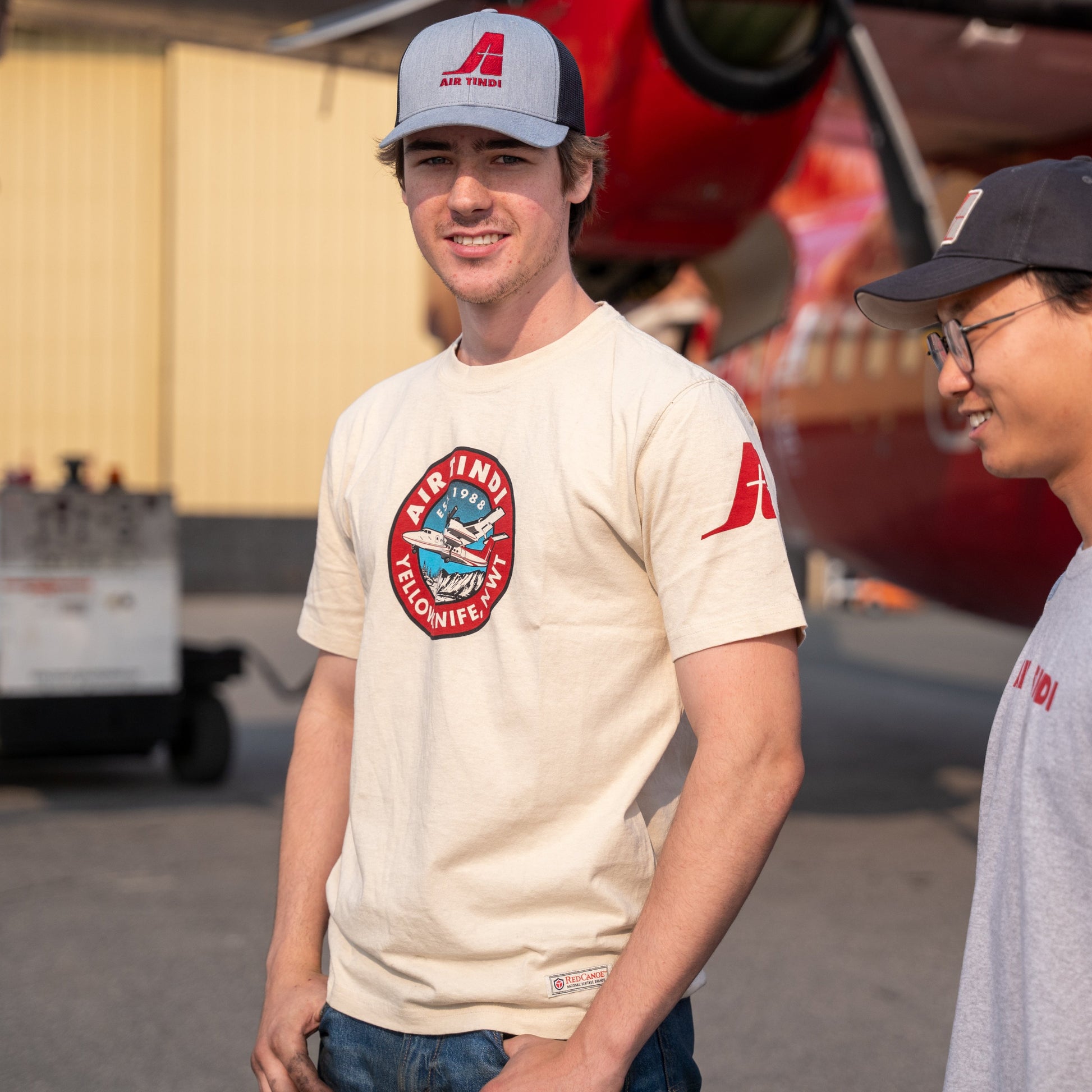 Model wearing an Air Tindi Classic Dash 7 T-Shirt in mens