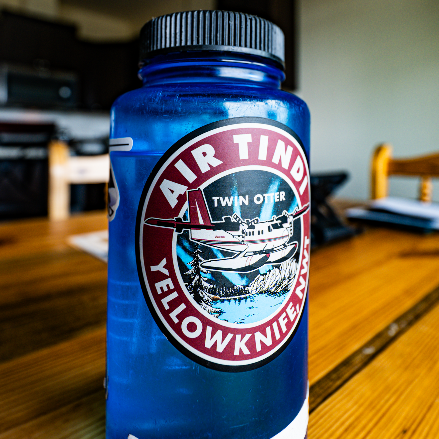 Blue water bottle with the Classic Twin Otter Sticker from Air Tindi Outpost