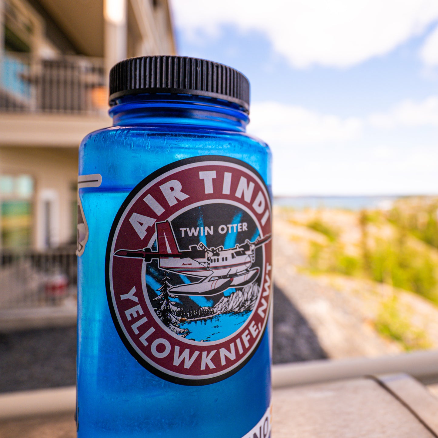 Blue water bottle featuring the 4 inch Classic Twin Otter Sticker