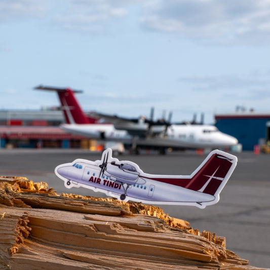 Air Tindi de Havilland DHC-7 Dash 7 die-cut sticker with aircraft in the background