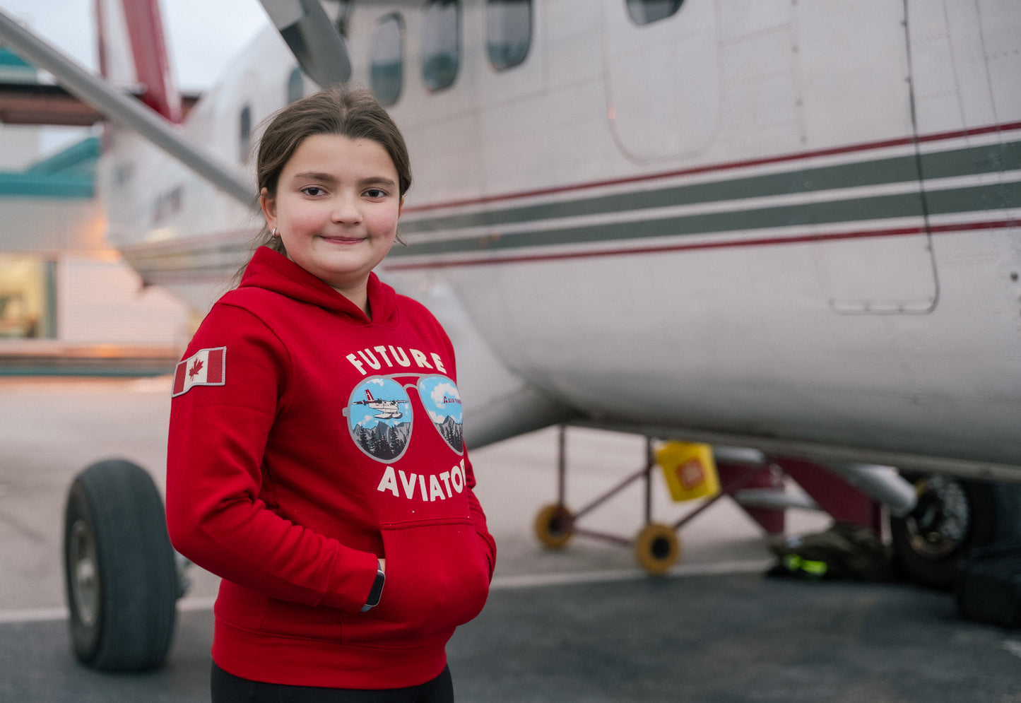 Model wearing an Air Tindi Future Aviator Youth Hoodie outdoors
