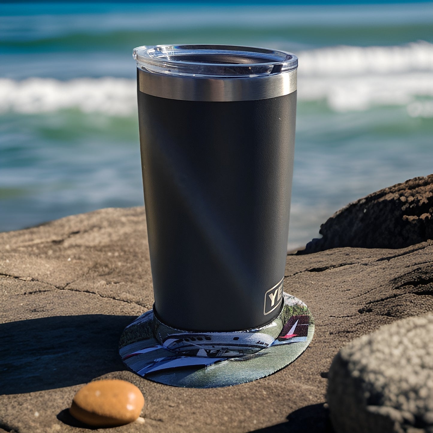 Air Tindi Lil’ Sucker cup holder in Air Tindi Floats securing a travel mug on a rock