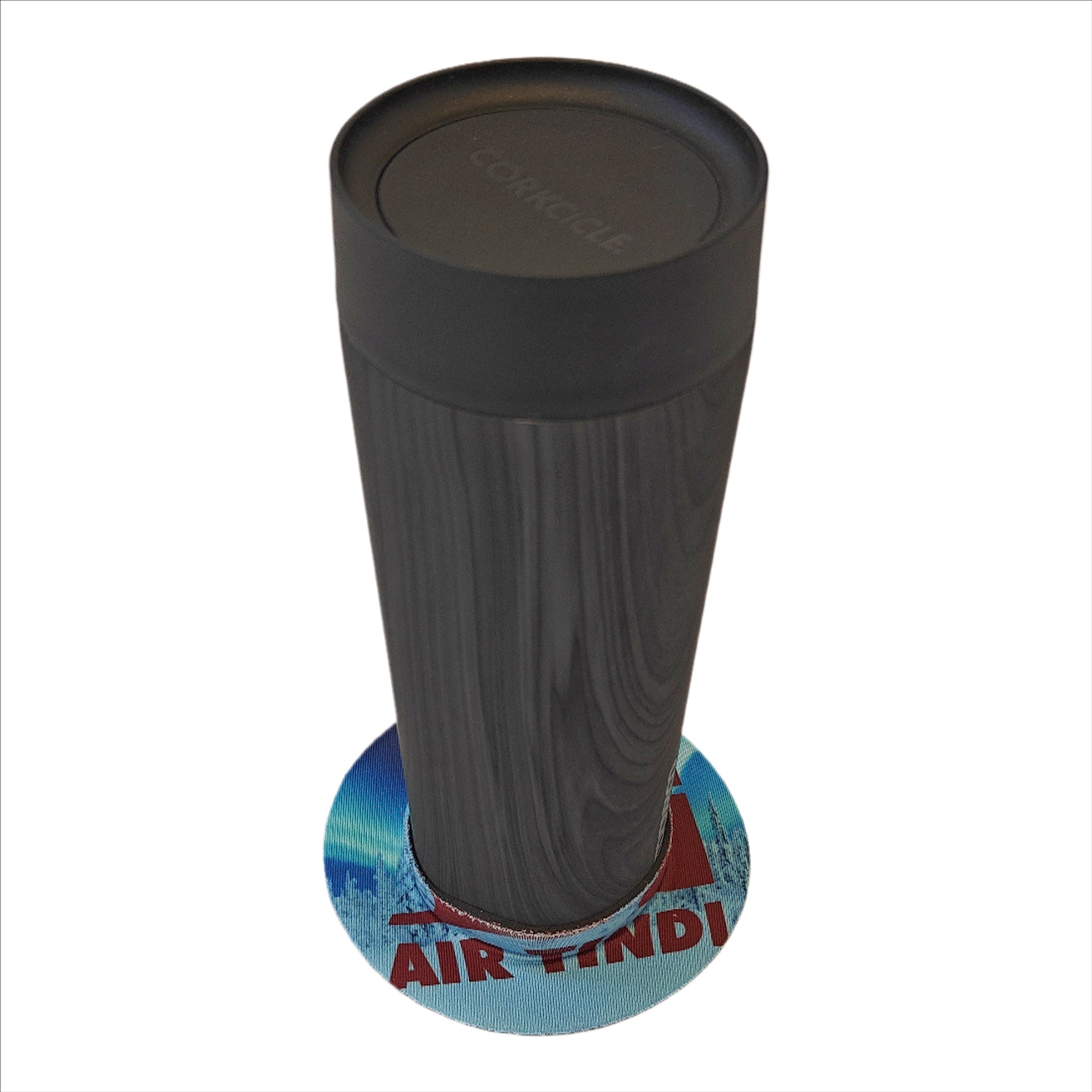 Air Tindi Lil’ Sucker cup holder featuring the Air Tindi Logo securing a travel mug on a countertop