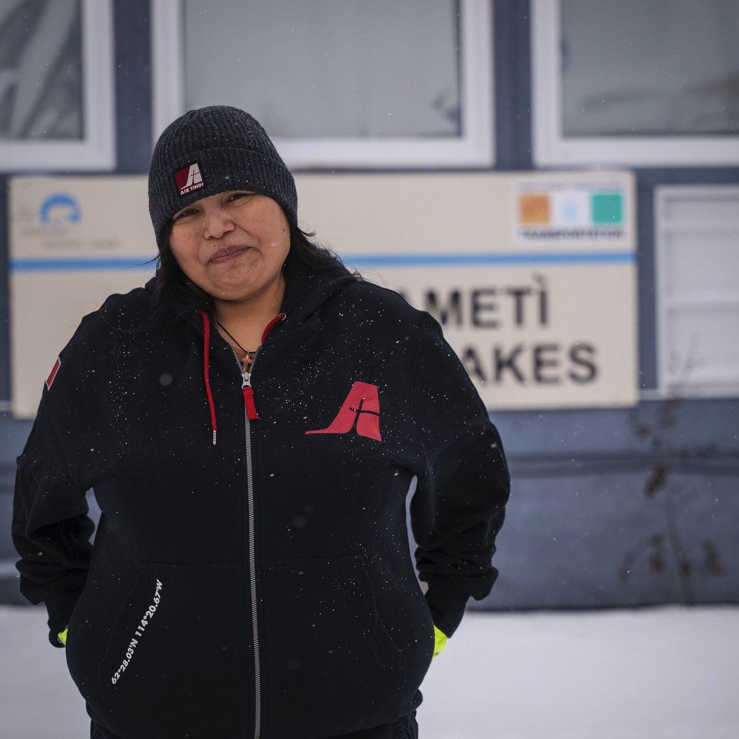 Model wearing an Air Tindi Signature Full Zip Unisex Hoodie with an Essential Wool Winter Toque