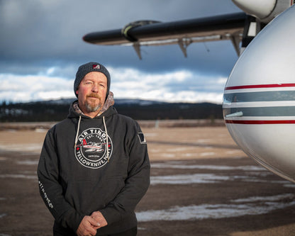 Model wearing an Air Tindi Twin Otter Hoodie outdoors